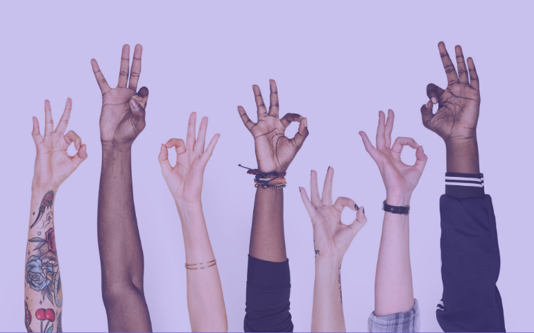 Picture showing hands of different generations - an O.K. sign.