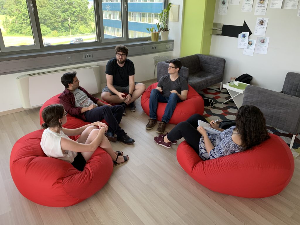 Participants of the Summer Challenge sitting and doing some brainstorming.