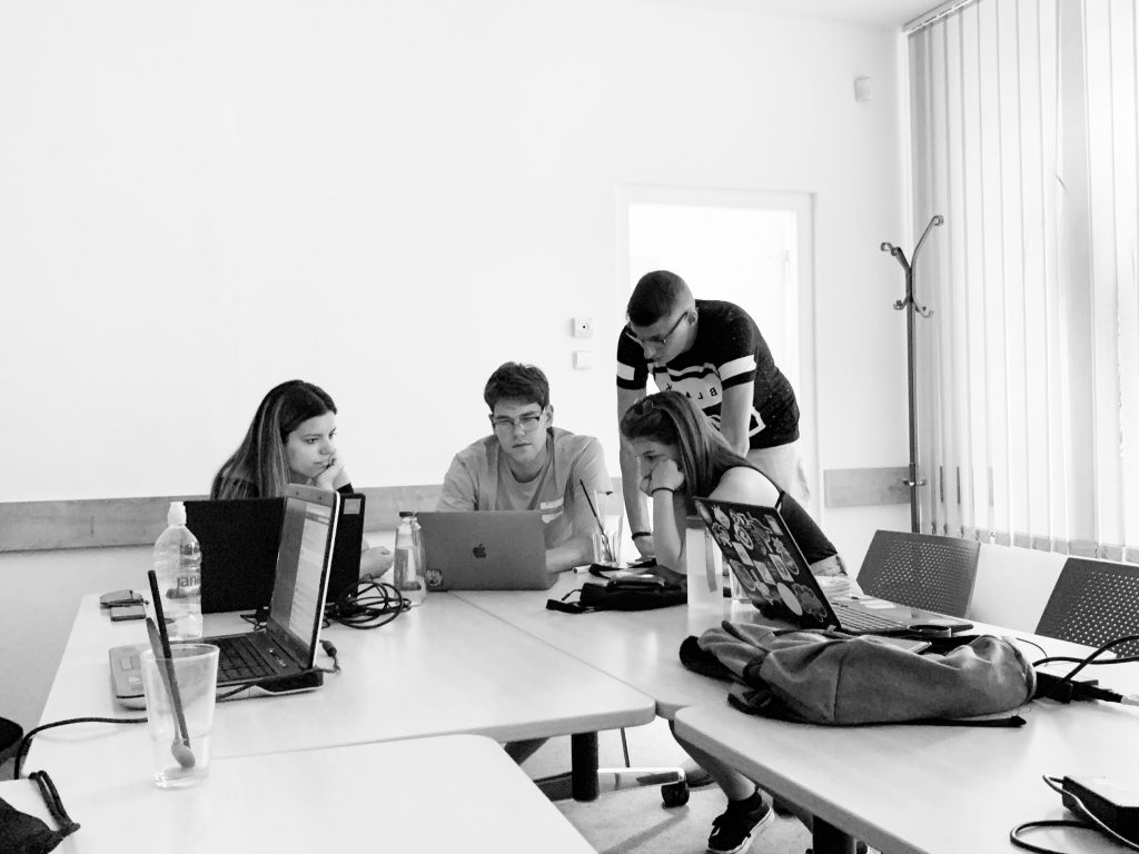 Team three working in the co-working space.